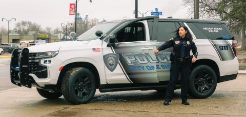 Pilar Stier standing in front of the new police cruiser outside the Le Sueur police station