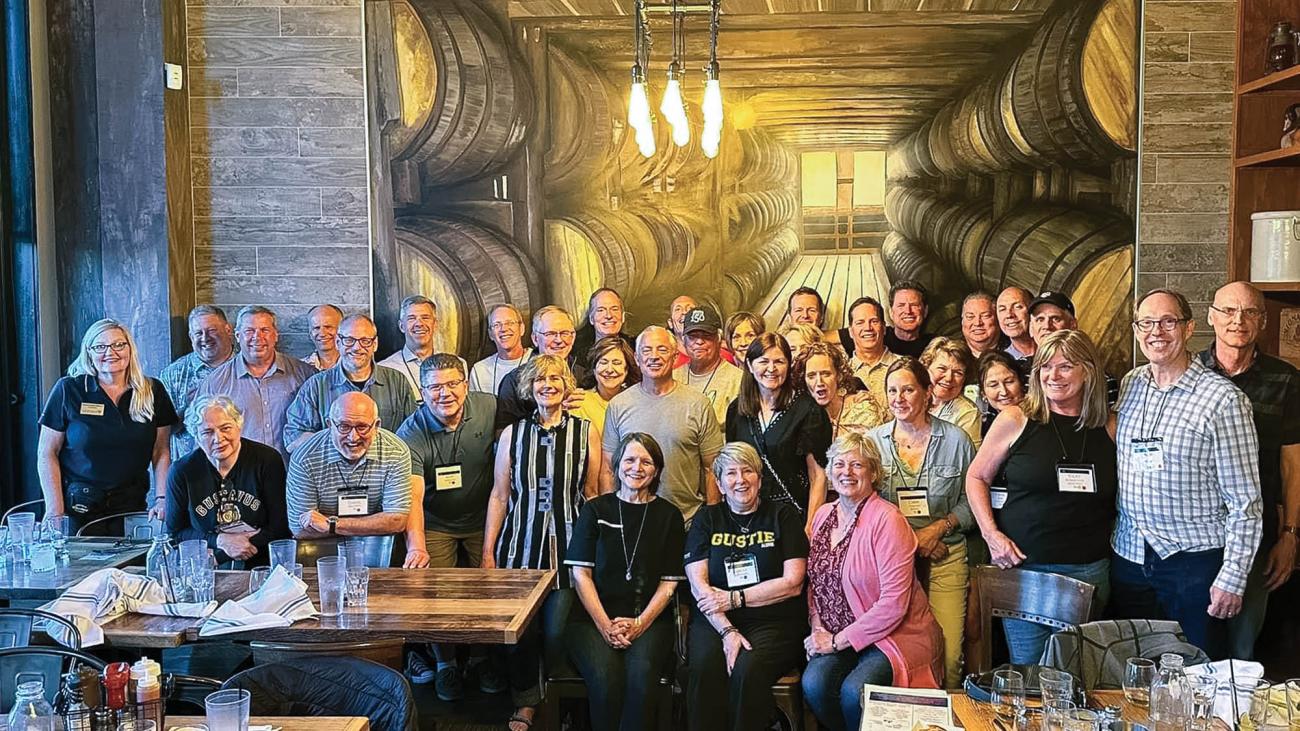 Many from the Gustavus Class of 1984 gathered among wine casks. 