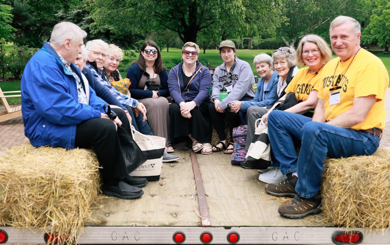 Many Gusties of many ages riding on a wagon. 