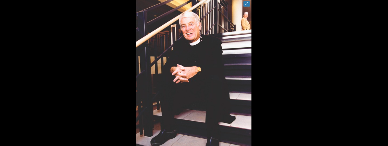 Chaplain Richard Elvee sitting on steps