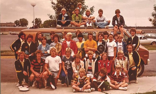 A group of tennis-loving kids by a van in the 1970s. 