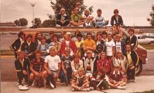 A group of tennis-loving kids by a van in the 1970s. 
