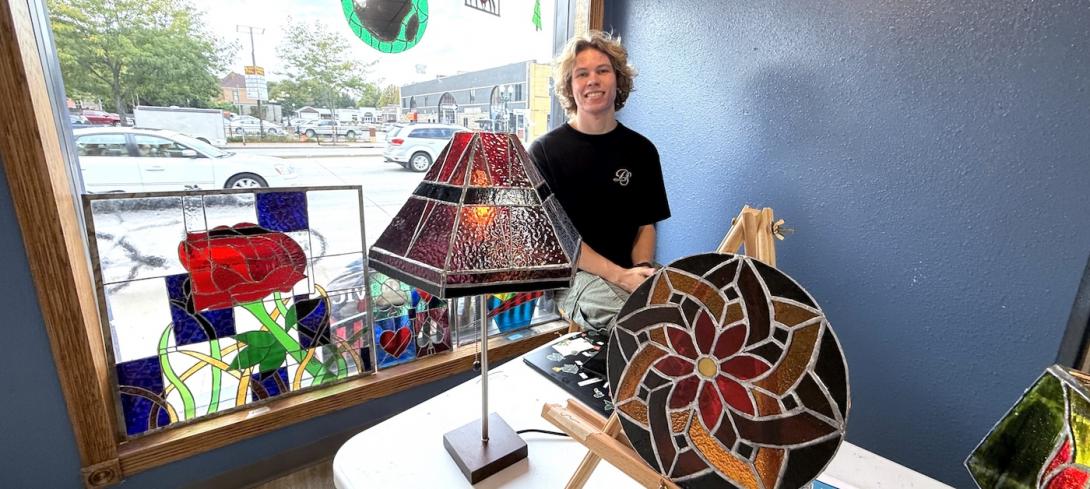 Studio Art and Computer Science double major Sam Teff ’27. He is known around Gustavus for his stained glass creations